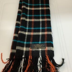 100% cashmere scarf made in Germany. Features a classic plaid/tartan pattern
